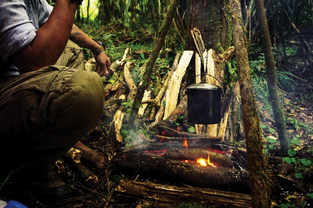 Boiling water for tea in the jungle of Indonesia.