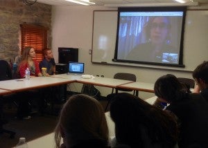 Teaching assistants Sarah Moffitt ’15 and Bill Law ’15 tune in from Lippitt Hall as Bridget Griffith ’11 leads Roger LeBrun’s honors course, “The Global Challenge of Emerging Infectious Disease” from South Africa.