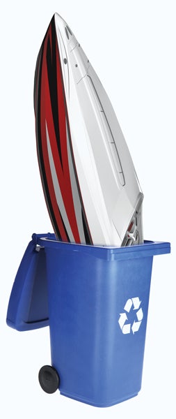 compsite image of powerboat sticking out of a recycling bin.