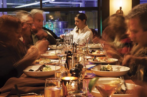 Diners at a bar table at Brix Restaurant.