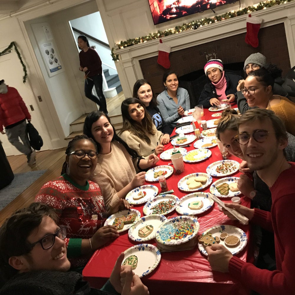 Students decorate holiday cookies in the cozy International Center lounge