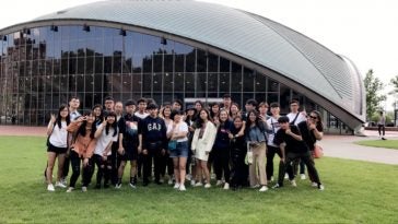 A group of students in the 2019 Taiwan Summer Institute gathered in front of a welcome center