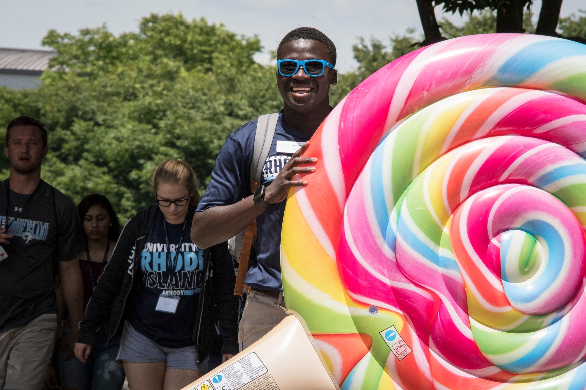 Student Holding Colorful Swirl Lollipop Inflatable