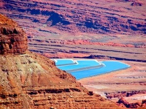 Portion of Dead Horse Point with Potash evaporite ponds in the background. These Potash Ponds are of economic significance in the creation of agricultural fertilizers. Photograph by Brianna Grenier 2014.