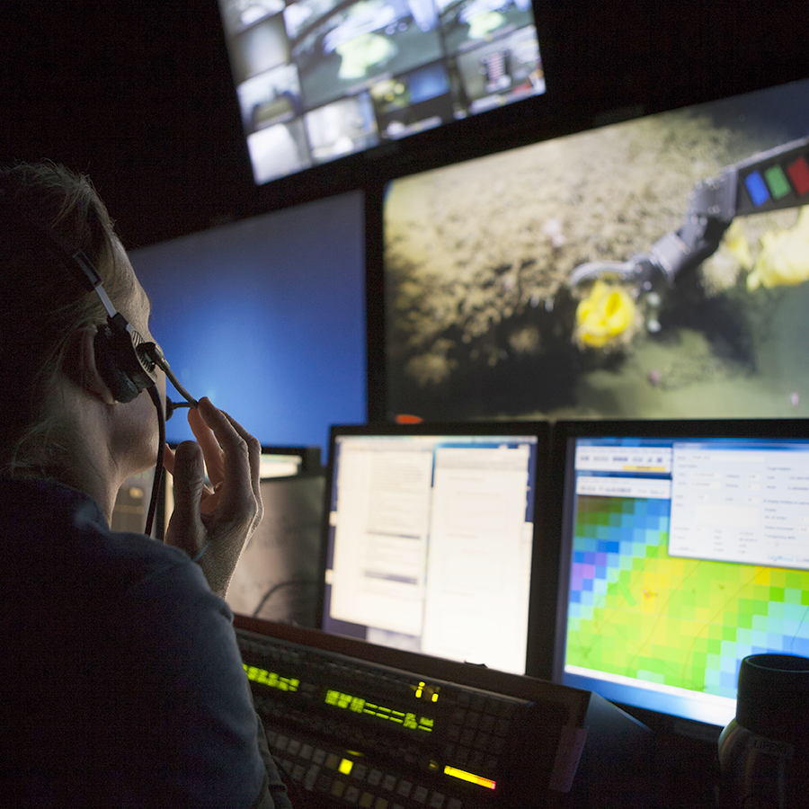 over-the-shoulder view of mission control displays