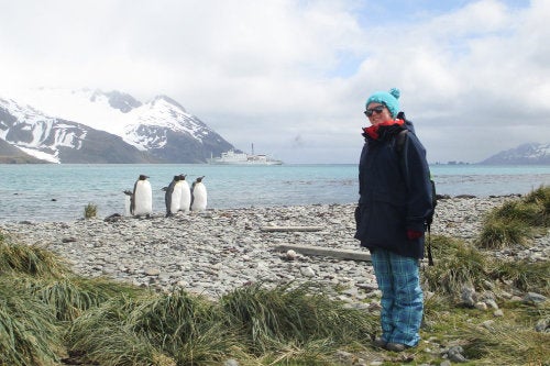 Breezy Grenier ’17 in Antarctica with penguins
