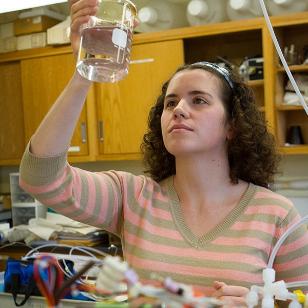 A student examines a water sample.