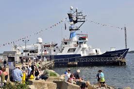 Visitors to GSO Open House enjoying the sunshine while waiting to tour the R/V Endeavor. Courtesy of Independent.com.