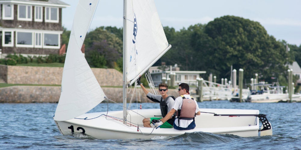 Two students sailing at the URI Sailing Center