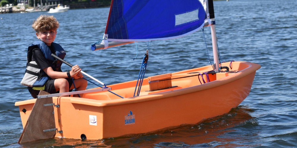 A student enrolled in the summer sailing program at the URI Sailing Center