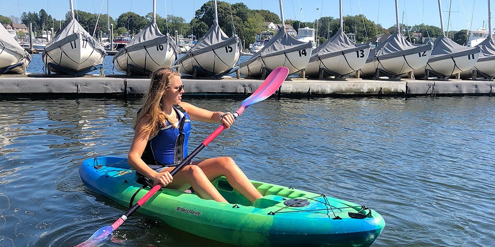 URI sailing center student kayaking in summer
