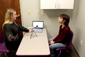 Speech pathology graduate student Erin Blanchette works with Rachel Ferreira on her pronunciation in the Kingston Speech and Hearing Center.